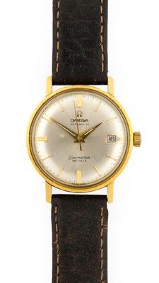 Lot 2294 - Omega: An 18 Carat Gold Automatic Calendar...