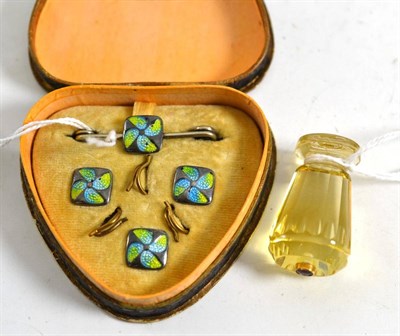 Lot 135 - Ruby set citrine coloured glass hand seal and a cased enamelled stud set