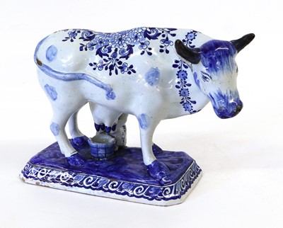 Lot 118 - A Dutch Delft Model of a Cow and Milkmaid,...