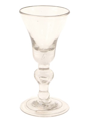 Lot 9 - A Baluster Wine Glass, circa 1710, the...