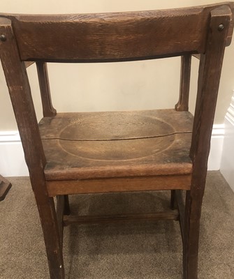Lot 651 - An Arts & Crafts Oak Chair, curved back rail...