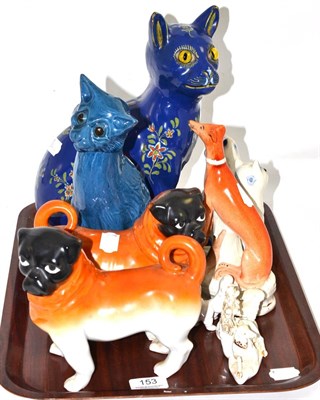 Lot 153 - A Brannam blue glazed pottery figure of a caricature cat, a Rouen faience cat, a pair of...