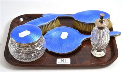 Lot 161 - A George V silver and blue guilloche enamel backed five piece vanity set