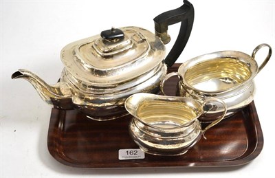 Lot 162 - A George V silver three piece tea service, Sheffield 1935, by Viners