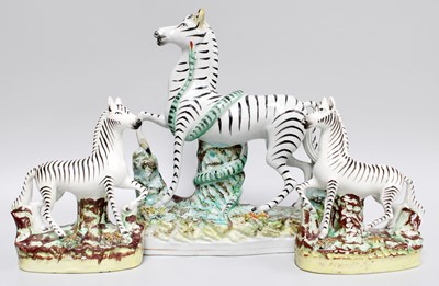 Lot 177 - Staffordshire Zebra, and a smaller pair (3)