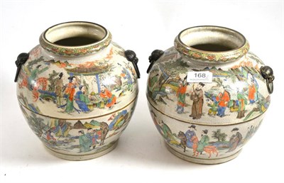 Lot 168 - A pair of Chinese famille verte crackle glaze vases with lion mask and ring handles, decorated with