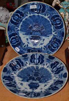 Lot 174 - A pair of Dutch Delft ";Peacock"; blue and white chargers (a.f.)