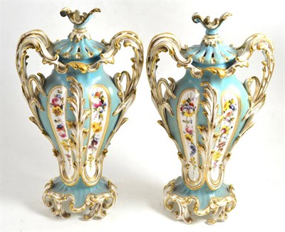 Lot 176 - Pair of early 19th century porcelain vases and covers of rococo scrolling form (restored)