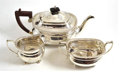 Lot 178 - A George VI three piece silver tea set, Birmingham 1946, and a pair of plated sugar tongs