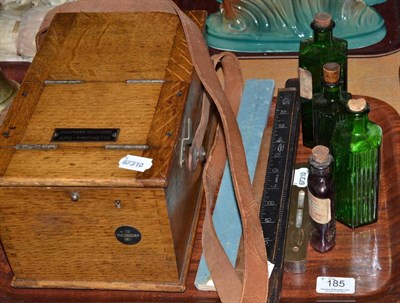 Lot 185 - Loftus ruler, other rulers and measures, street light meter (Holophane) and pharmacy bottles