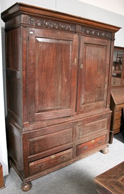 Lot 1336 - An 18th Century Oak Tack Cupboard, with...