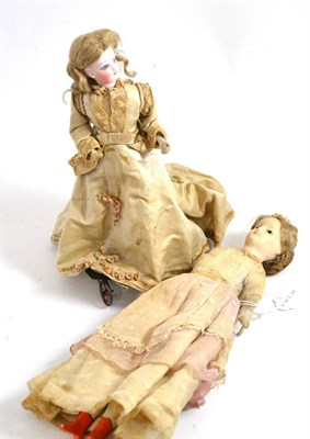 Lot 187 - 19th century wax mounted shoulder head doll, with fixed brown eyes, original wig worn in a bun with