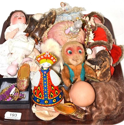 Lot 193 - Two small bisque head dolls, two china half dolls, two clockwork toys, three paste set buckles...