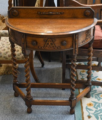 Lot 1155 - A 20th Century Carved Oak Demi Lune Hall Table,...