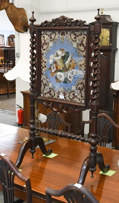 Lot 1151 - A Victorian Carved Mahogany Firescreen, with...