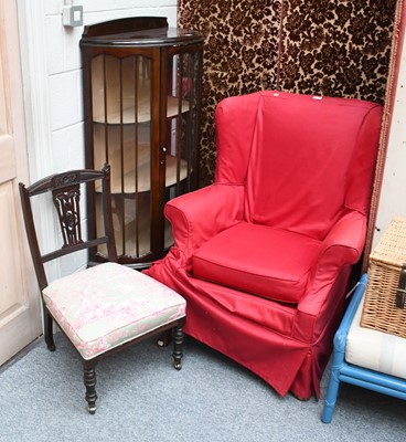 Lot 1128 - A Georgian Style Wing Chair, a demi lune...