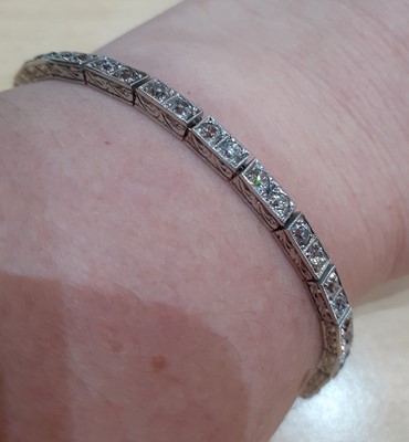 Lot 2320 - A Diamond Line Bracelet comprising of...