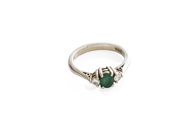 Lot 1031 - An 18 Carat Gold Emerald and Diamond Three...