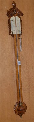 Lot 232 - An oak stick barometer signed Nickalls Reigate