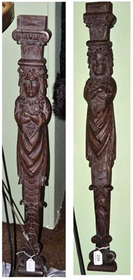 Lot 234 - A pair of 19th century figural carved oak pilasters