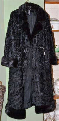 Lot 235 - Herbert Duncan, London black astrakhan double breasted coat with black mink trimmed collar,...