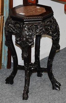 Lot 1249 - A Chinese Carved Hardwood Octagonal Plant...