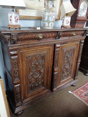 Lot 1229 - A Carved Oak Side Cabinet, 18th century with...