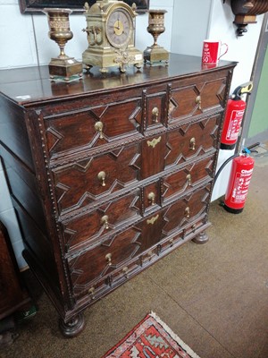 Lot 1231 - An 18th century Oak Geometric Fronted Chest,...