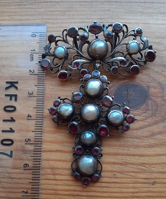 Lot 2077 - A Red Stone and Split Pearl Pendant the scroll...