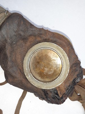 Lot 60 - A First World War German Leather Gas Mask,...