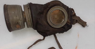 Lot 60 - A First World War German Leather Gas Mask,...