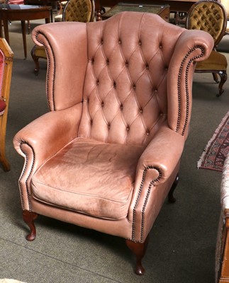 Lot 1178 - A Georgian Style Buttoned Leather Wing Chair