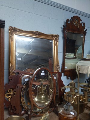 Lot 1135 - A Georgian Figured Walnut Fret Cut Wall Mirror,...