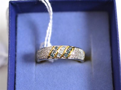 Lot 272 - A 9ct gold blue and white diamond pavê set band ring