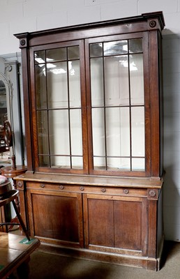 Lot 1212 - A George III Oak Glazed Bookcase, the lower...