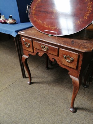 Lot 1222 - An 18th Century Lowboy, the top with canted...