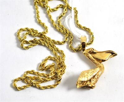 Lot 287 - A Sanibel Island, Florida gold pelican pendant and neck chain