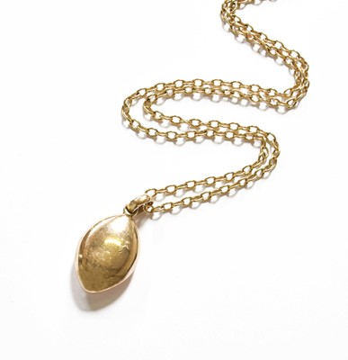 Lot 43 - A Locket on Chain, the oval locket suspended...