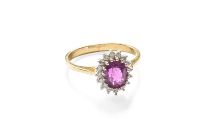 Lot 50 - A 9 Carat Gold Ruby and Diamond Cluster Ring,...