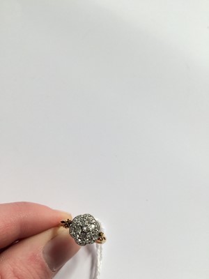 Lot 60 - A Diamond Cluster Ring, the central raised old...