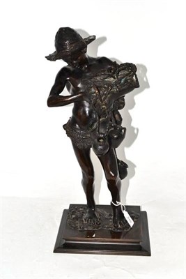 Lot 249 - A Bronze Figure of a Boy, early 20th century, standing in straw hat and loin cloth holding...