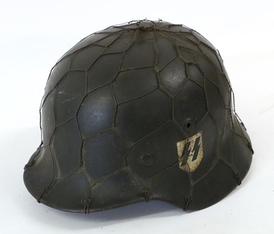 Lot 98 - A Second World War German M40 Combat Helmet,...