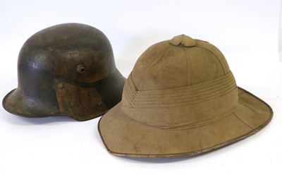 Lot 99 - A First World War German M16 Combat Helmet...