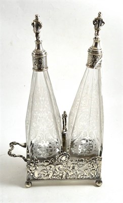 Lot 313 - Dutch silver two-handled decanter stand, fitted with two engraved decanters (damages)