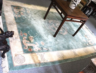 Lot 1209 - A Large Chinese Carved Carpet, the mint green...