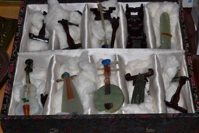 Lot 322 - Nine Chinese hardstone musical instruments and stands, boxed