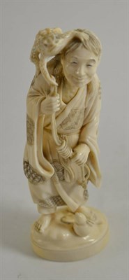 Lot 338 - A Japanese elephant ivory figure of a sennin with toad, circa 1910