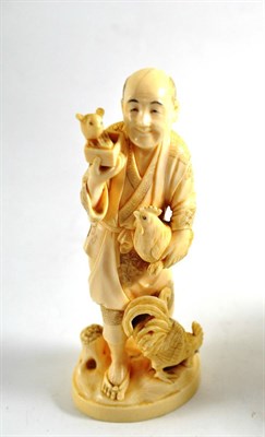 Lot 342 - A Japanese elephant ivory figure of a peasant and three fowl, circa 1910