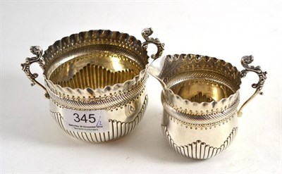 Lot 345 - A late Victorian silver milk jug and sugar basin in the 17th century style, London 1887