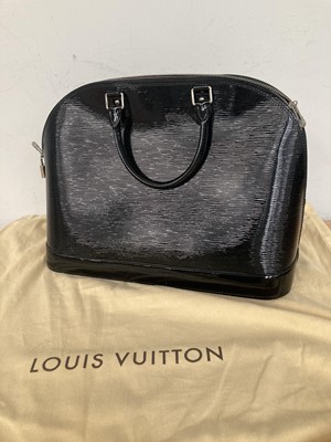 Lot 1048 - A Large Louis Vuitton Black Patent Epi Leather...